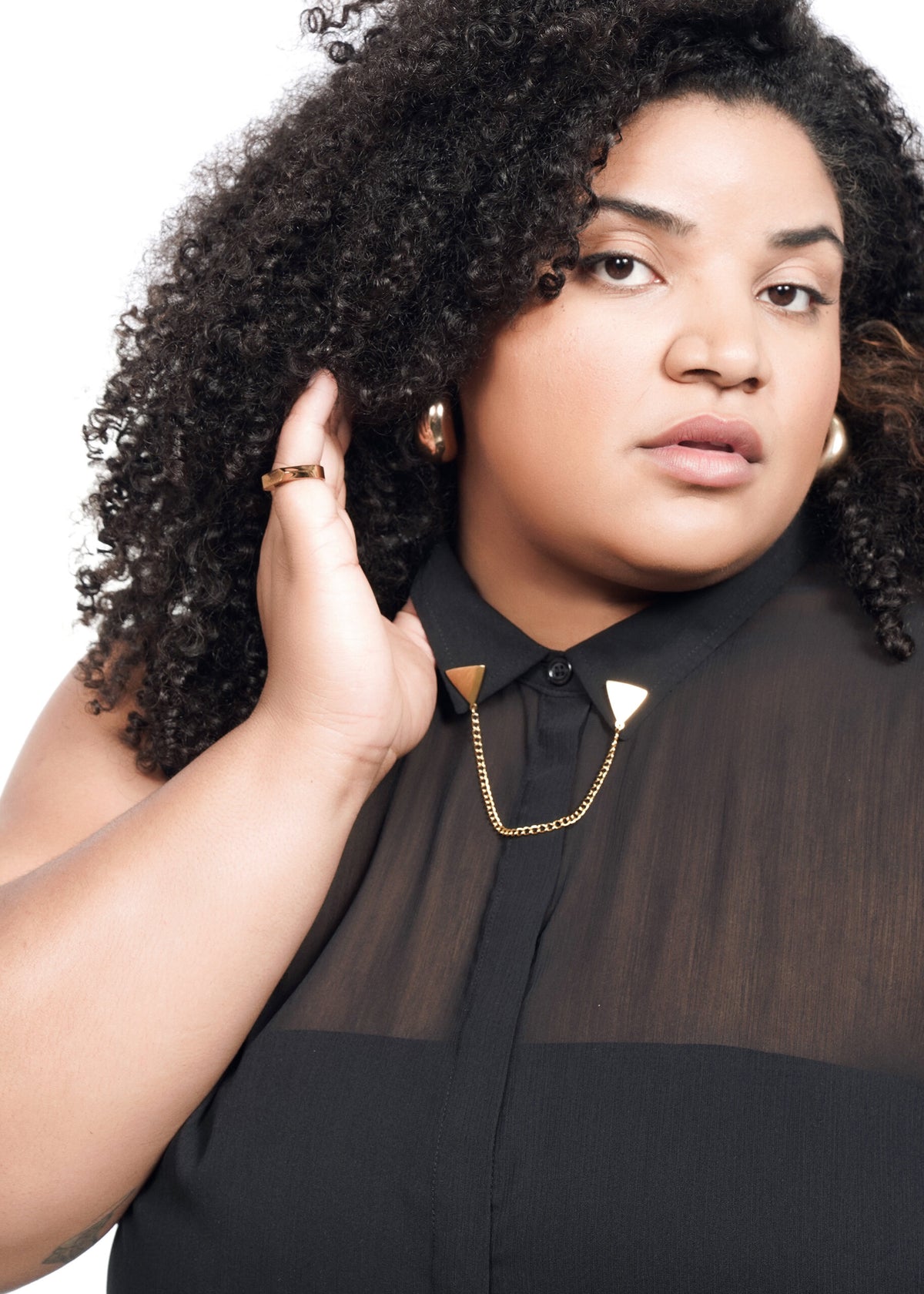 Closeup of The Empower Sheer Sleeveless Button Up in Black