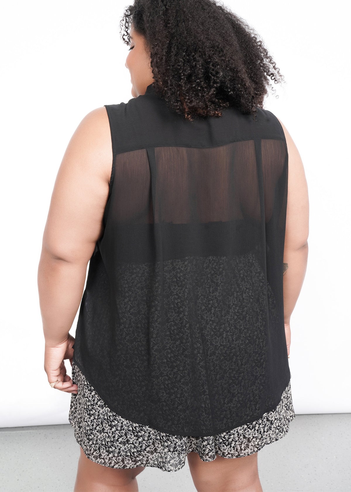 Back shot of The Empower Sheer Sleeveless Button Up in Black
