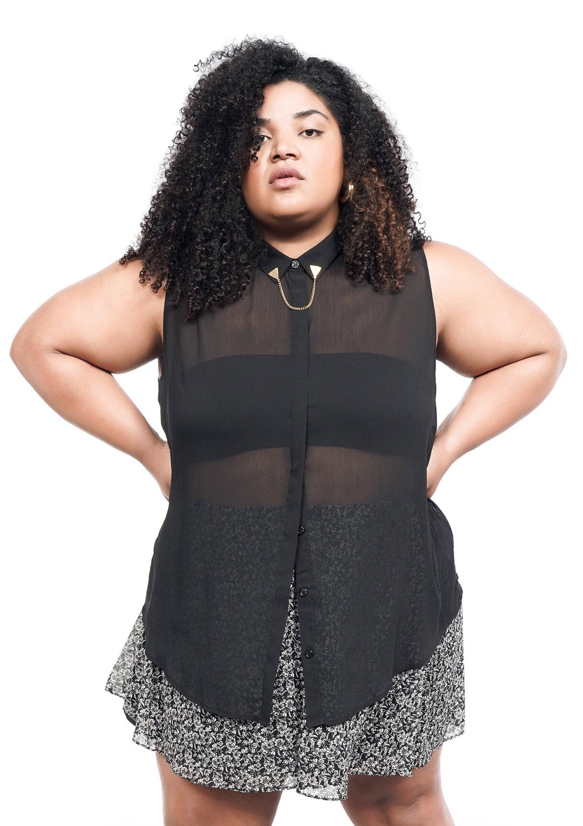 Model wearing The Empower Sheer Sleeveless Button Up in Black