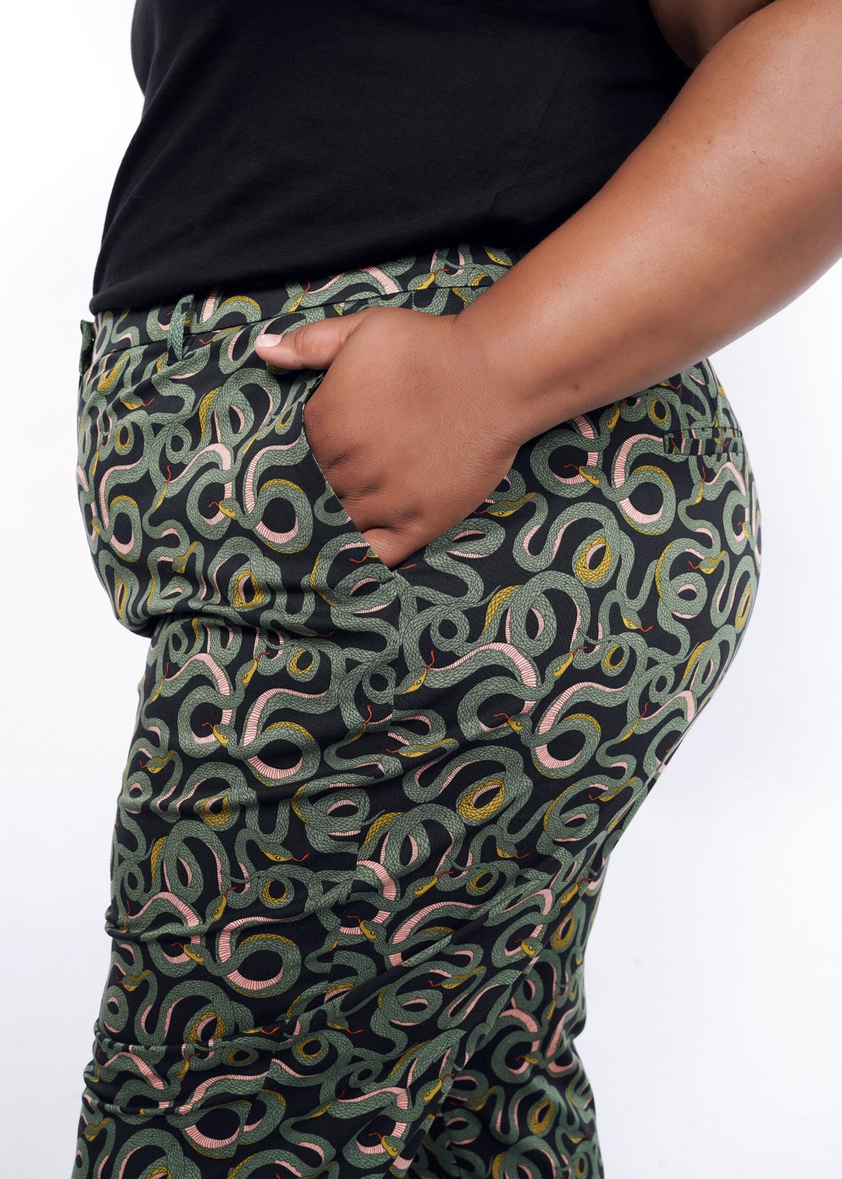 Model wearing The Empower Slim Crop Pant in Serpentine Black