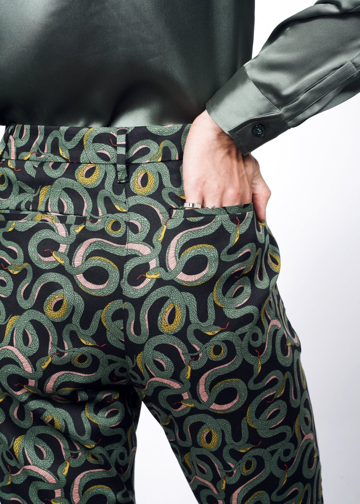 Model wearing The Empower Slim Crop Pant in Serpentine Black