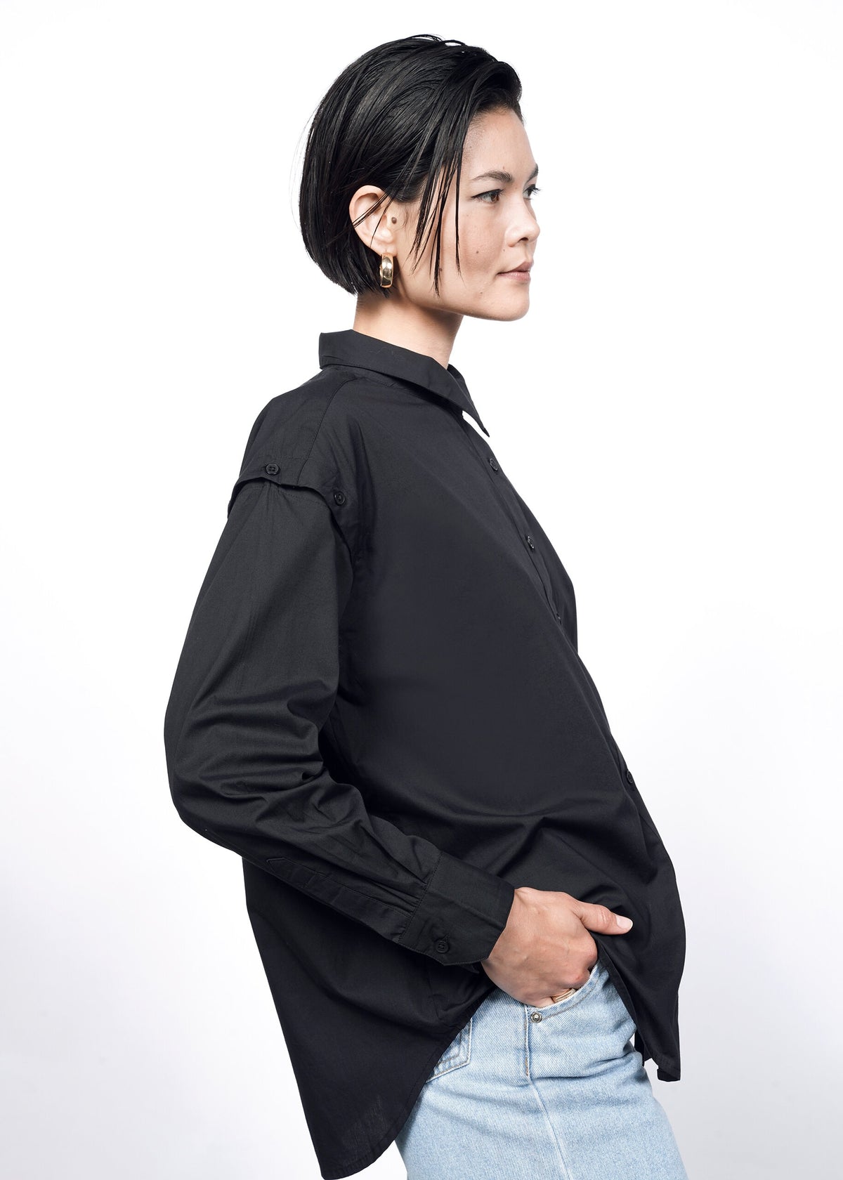 Model wearing The Essential 12-Way Button Up in Black