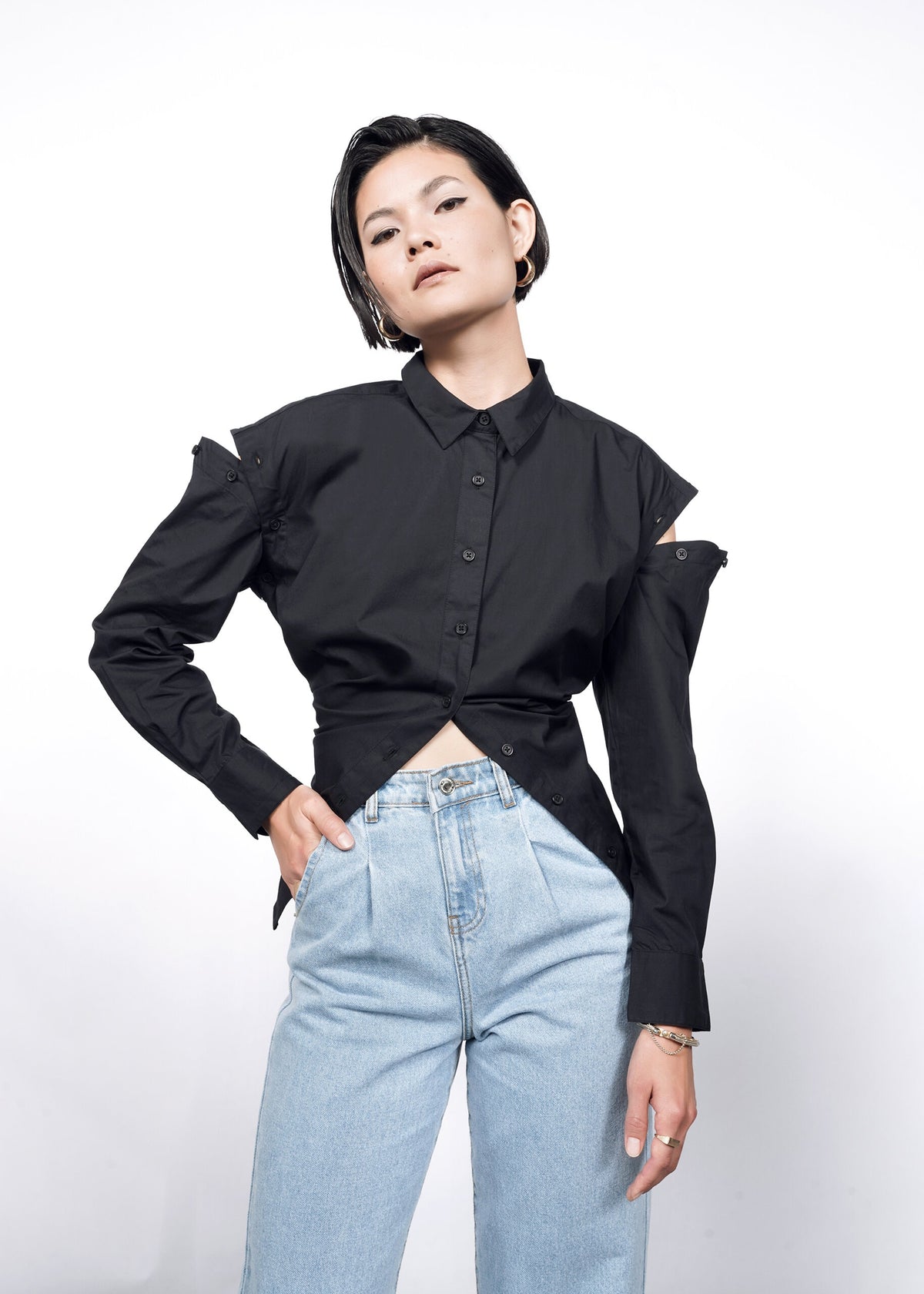 Model wearing The Essential 12-Way Button Up in Black