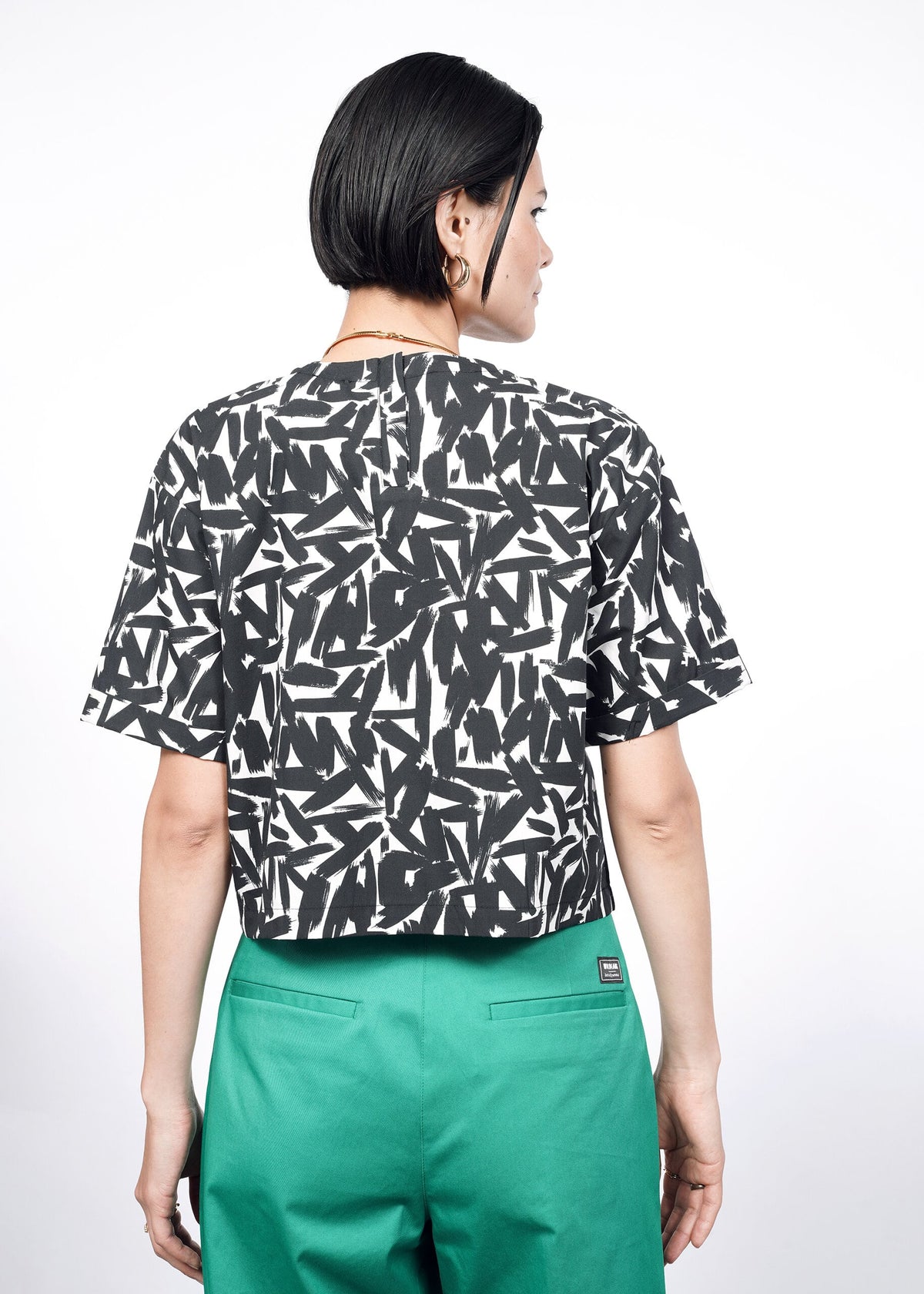 Model wearing The Essential Boxy Top in Paint Stroke White