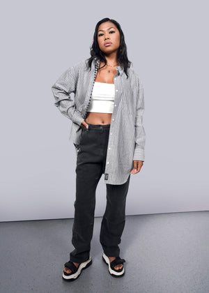 S= Model wearing The Essential Gingham Long Sleeve Oversized Convertible Button Up in Stripe Navy