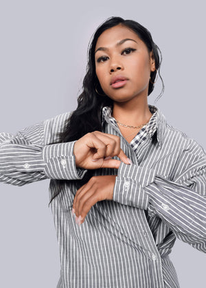 S=Model wearing The Essential Gingham Long Sleeve Oversized Convertible Button Up in Stripe Navy