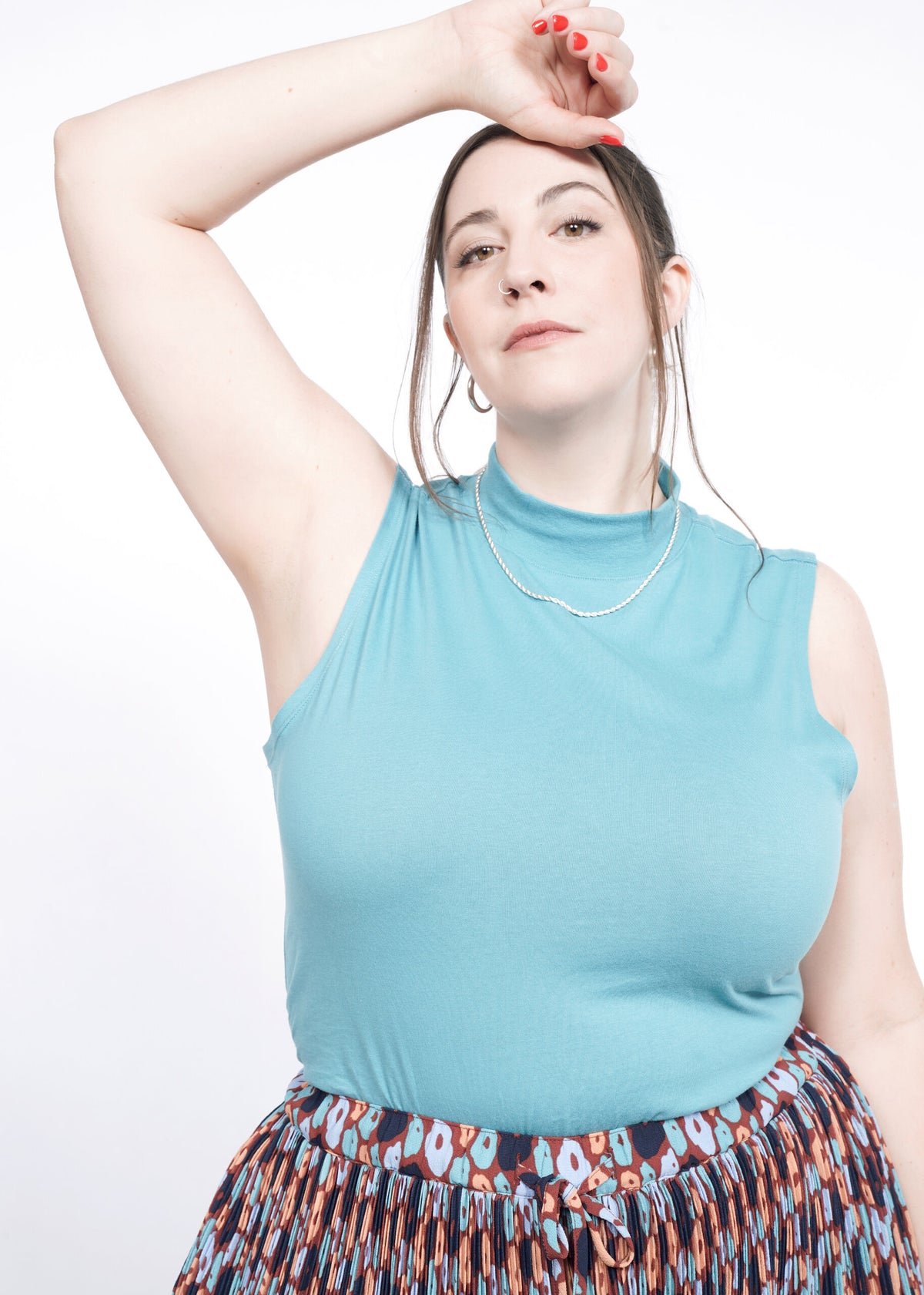 Model wearing The Essential Mock Neck Tank in Coastal