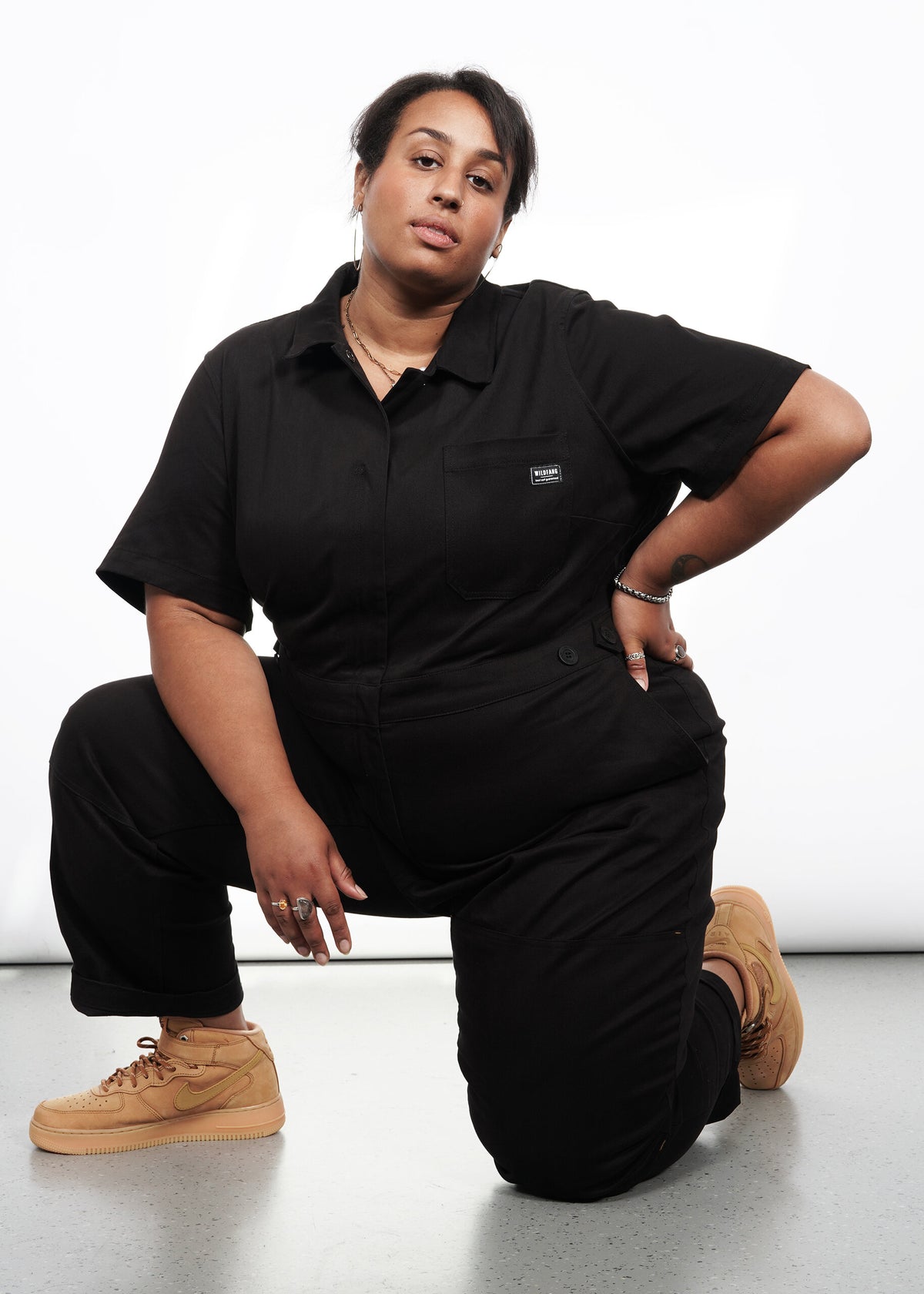 Model wearing The Essential High Waisted Coverall in Black
