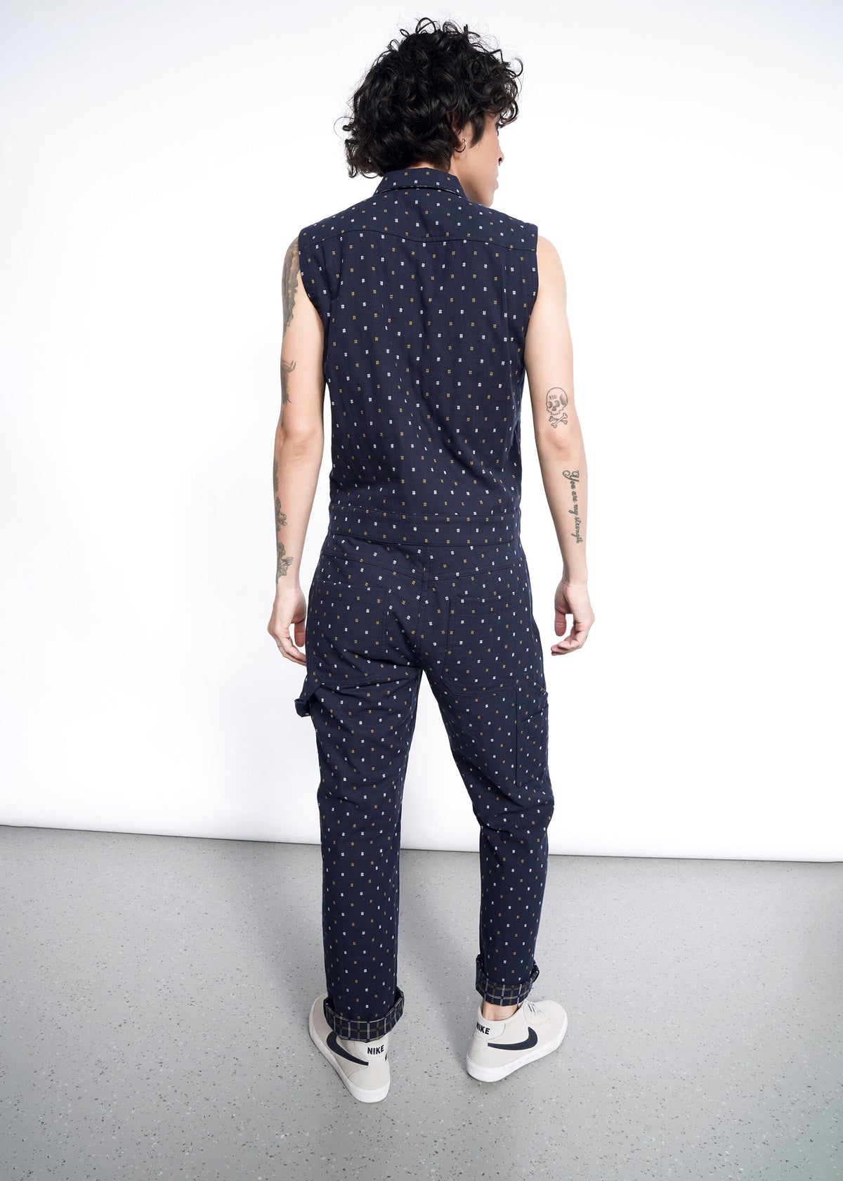 Model wearing The Essential Sleeveless Coverall in Hashtag Navy
