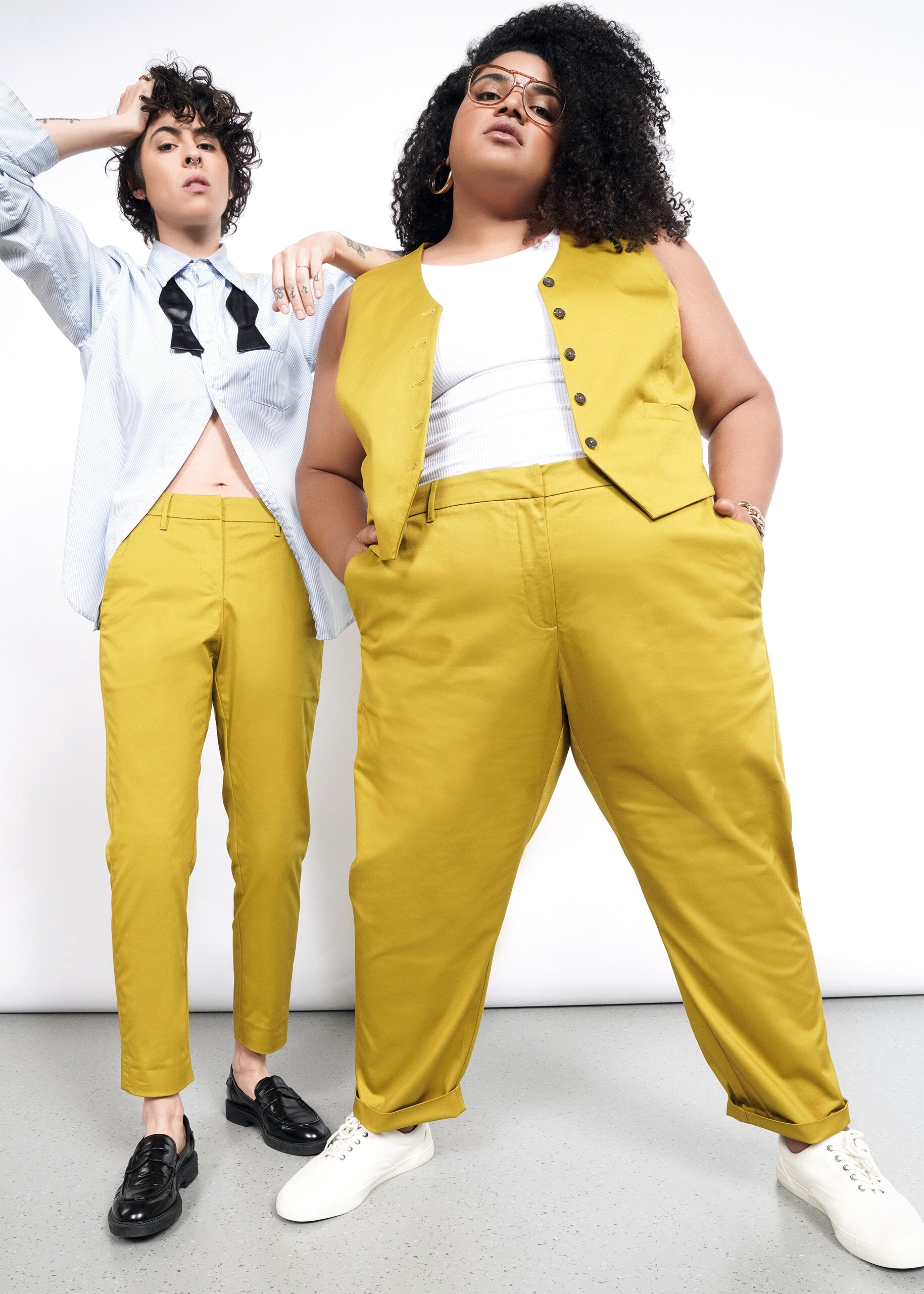 Two models wearing The Essential Slim Crop Pant in Dijon