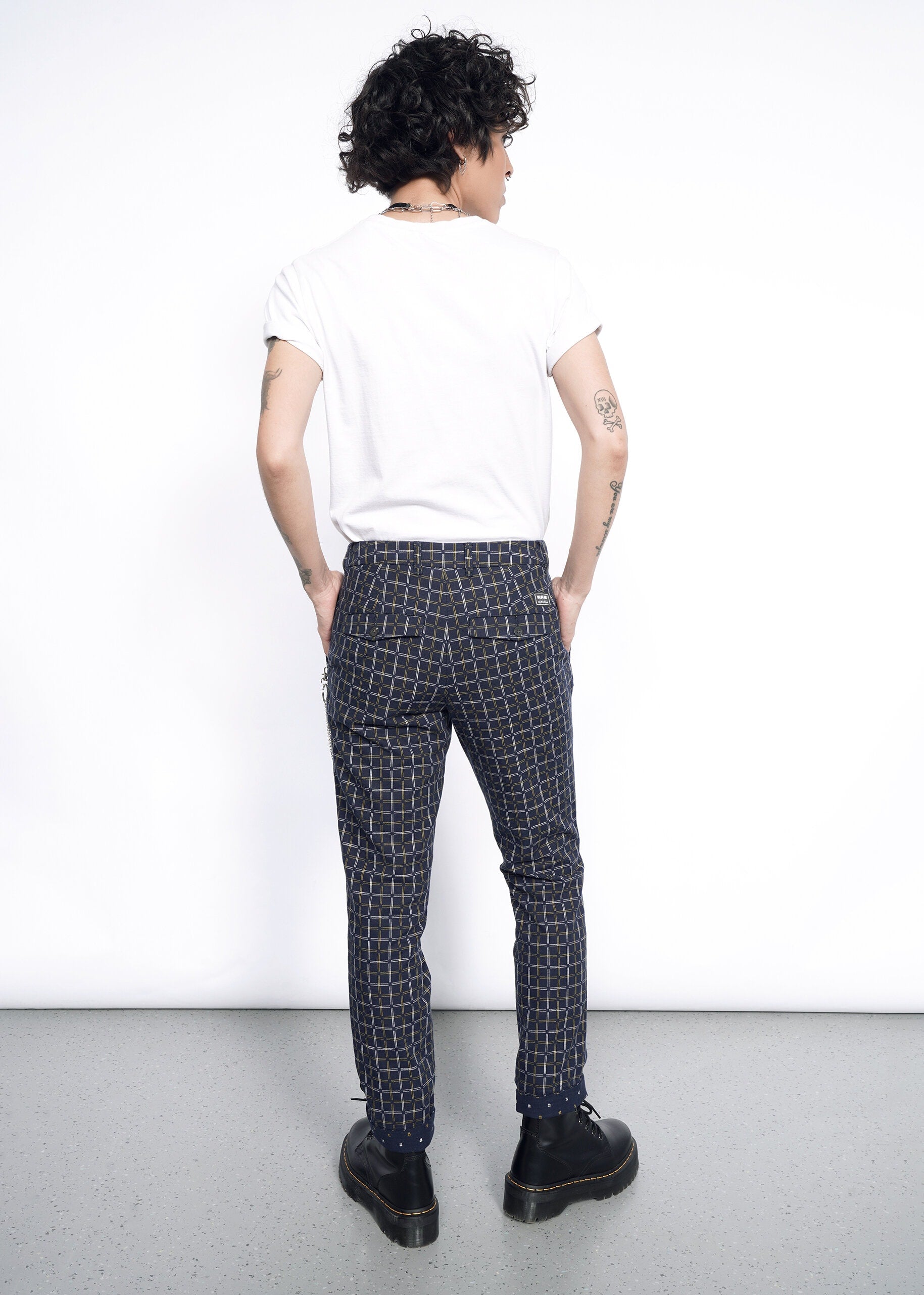 Model wearing The Essential Trouser in Grid Navy