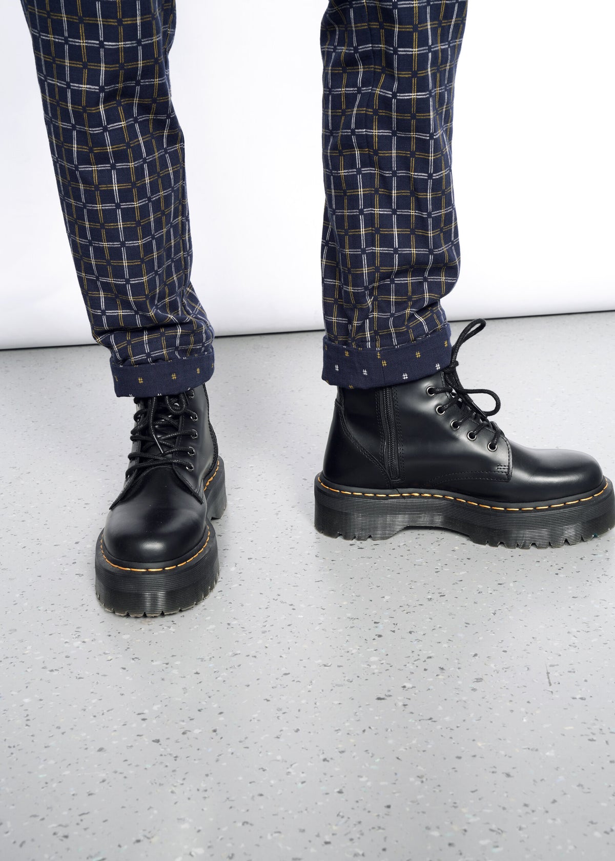 Model wearing The Essential Trouser in Grid Navy