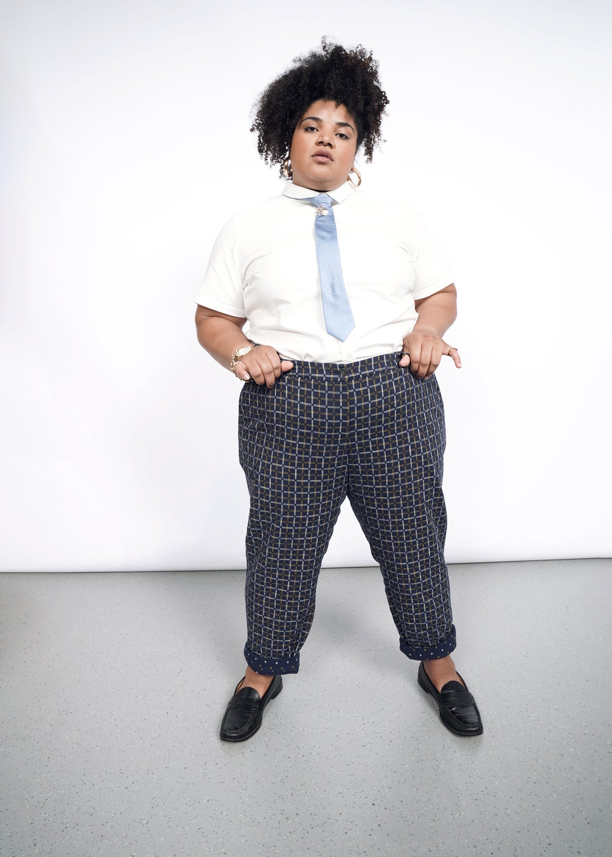 Model wearing The Essential Trouser in Grid Navy