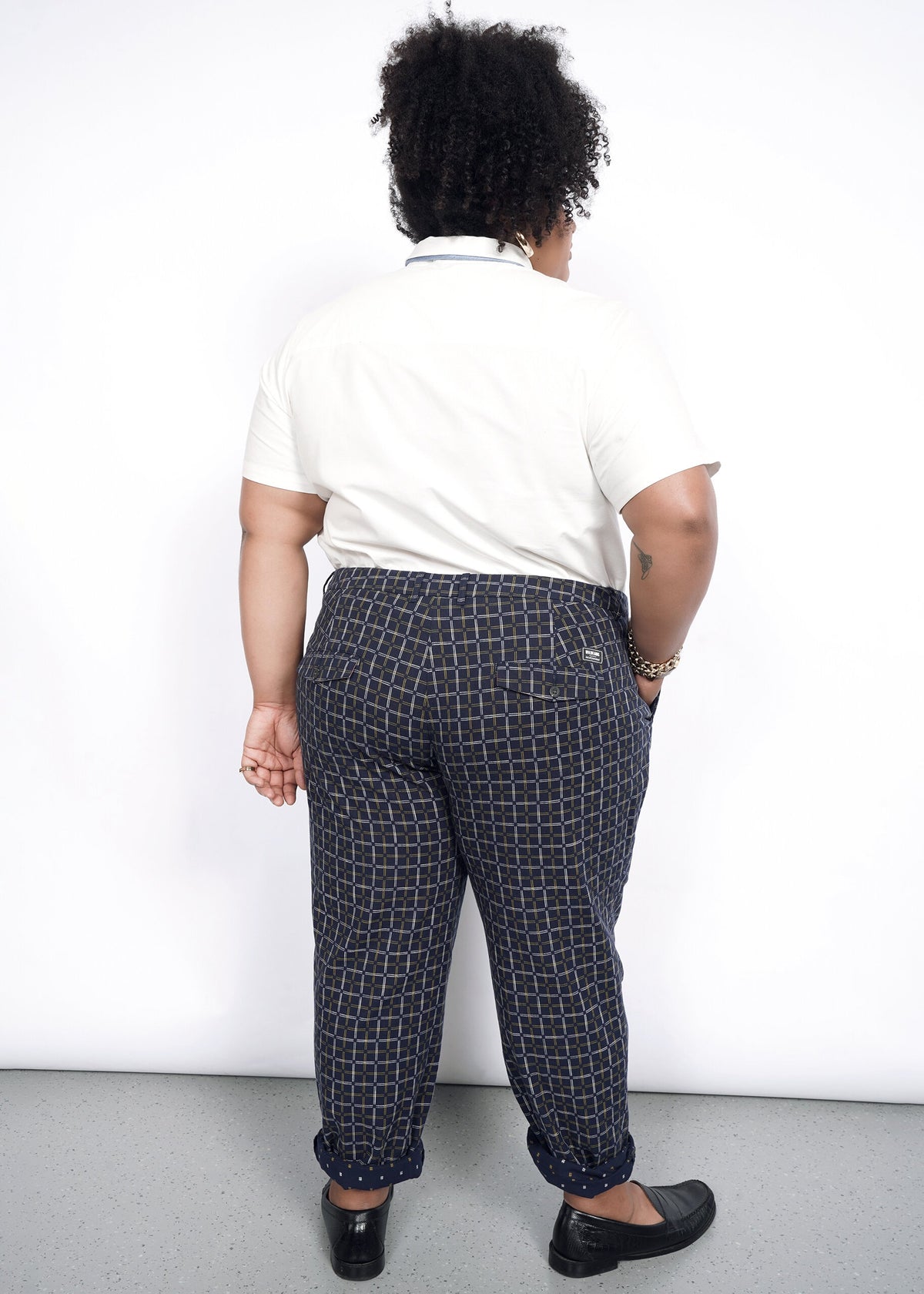 Model wearing The Essential Trouser in Grid Navy