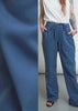This video shows The Everyday Elastic Waist Paint in Oxford Blue on two models. Close up shots show the drawstring waist, the side and back pockets, and the elastic waistband. The video ends with a split screen side by side shot of the two models wearing the pant to show how it fits on different bodies.