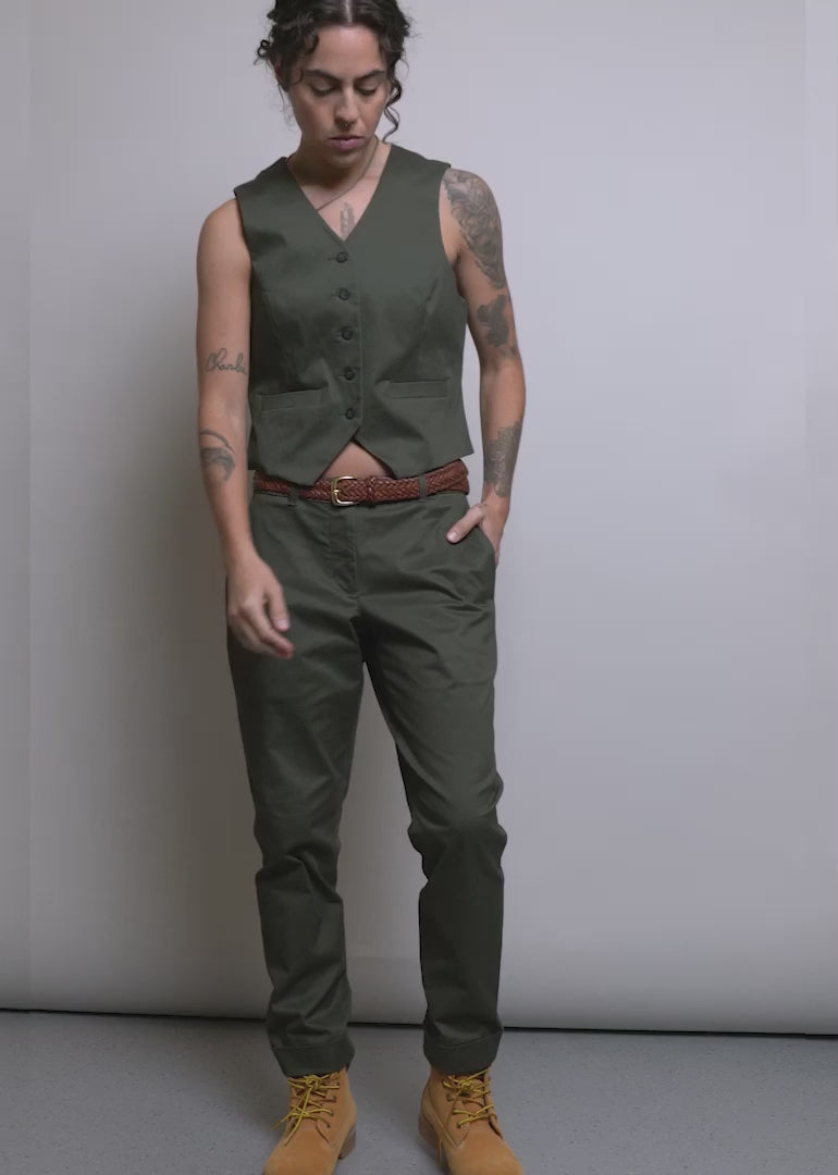 Model wearing The Essential Trouser in Spruce shows off the fit and features of the product.