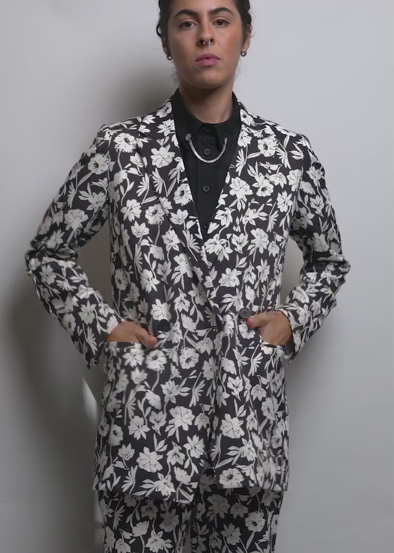 Model wearing The Empower Double Breasted Blazer in Monochrome Floral shows the fit and features of the blazer.