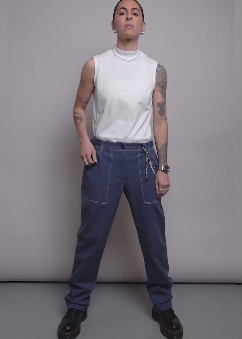 Model shows the fit and features of The Juliette Lewis X Wildfang Denim Utility Pant