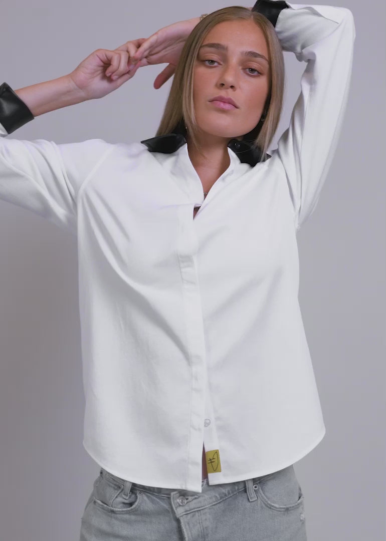 Video of two models wearing The Debbie Harry x Wildfang Long Sleeve Button Up and showing the fit and features