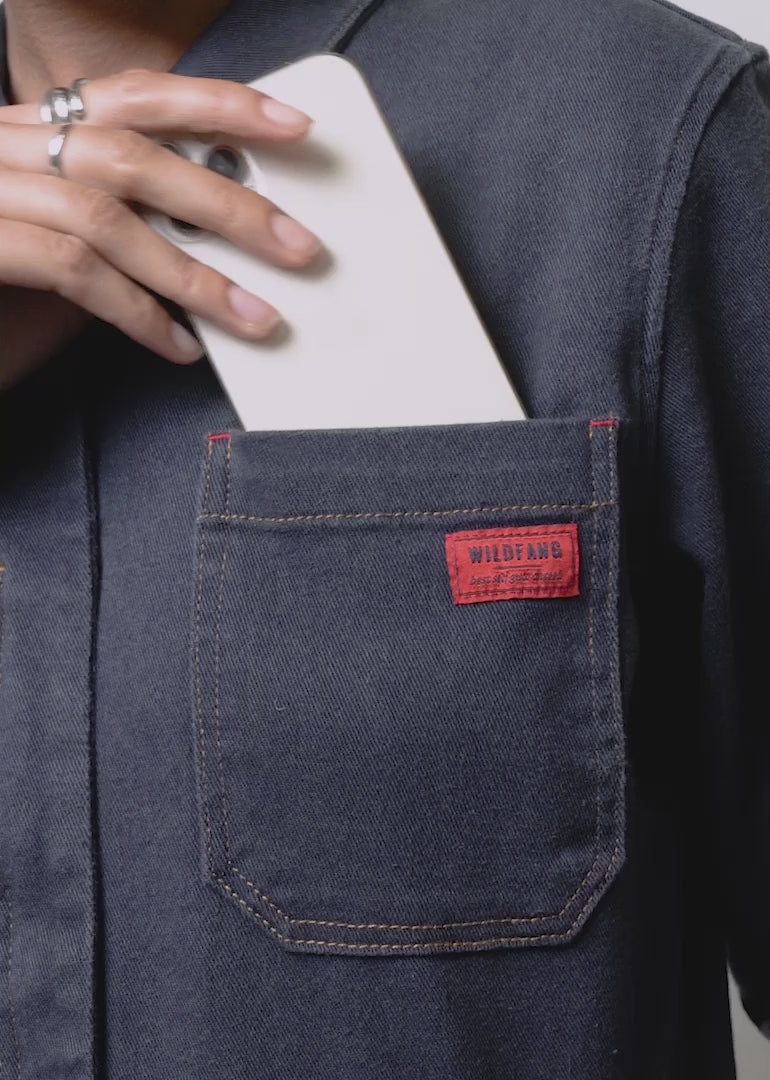 Model shows fit and features of The Essential Denim High Waisted Coverall.