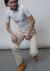 Video shows models of two different sizes wearing The Essential Utility Pant. Video features close ups of the front and back pockets, adjustable waist detail, and shows models bending and crouching to show stretch in fabric.