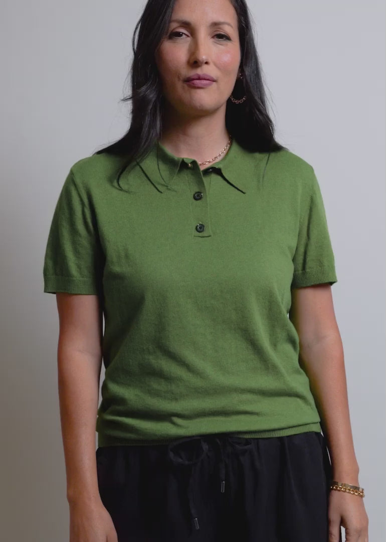 Video of two models wearing The Everyday Polo Sweater in Moss Green and showing the fit and features