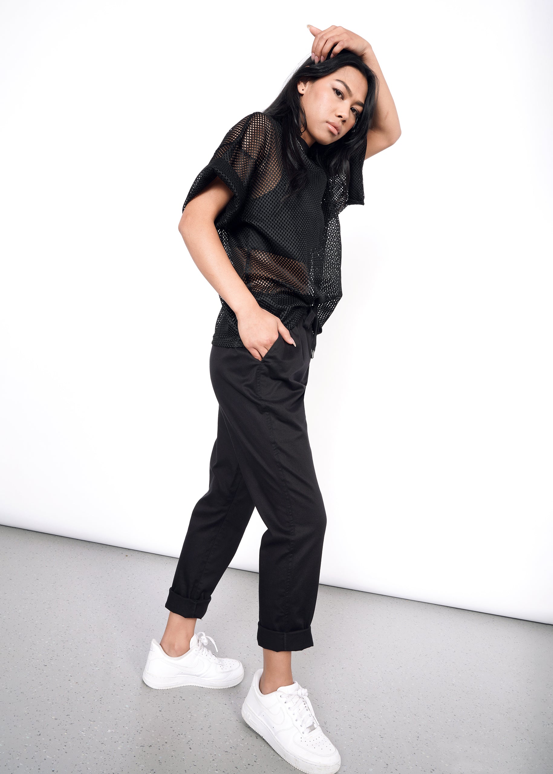Sideview of black drawstring pant on secondary model