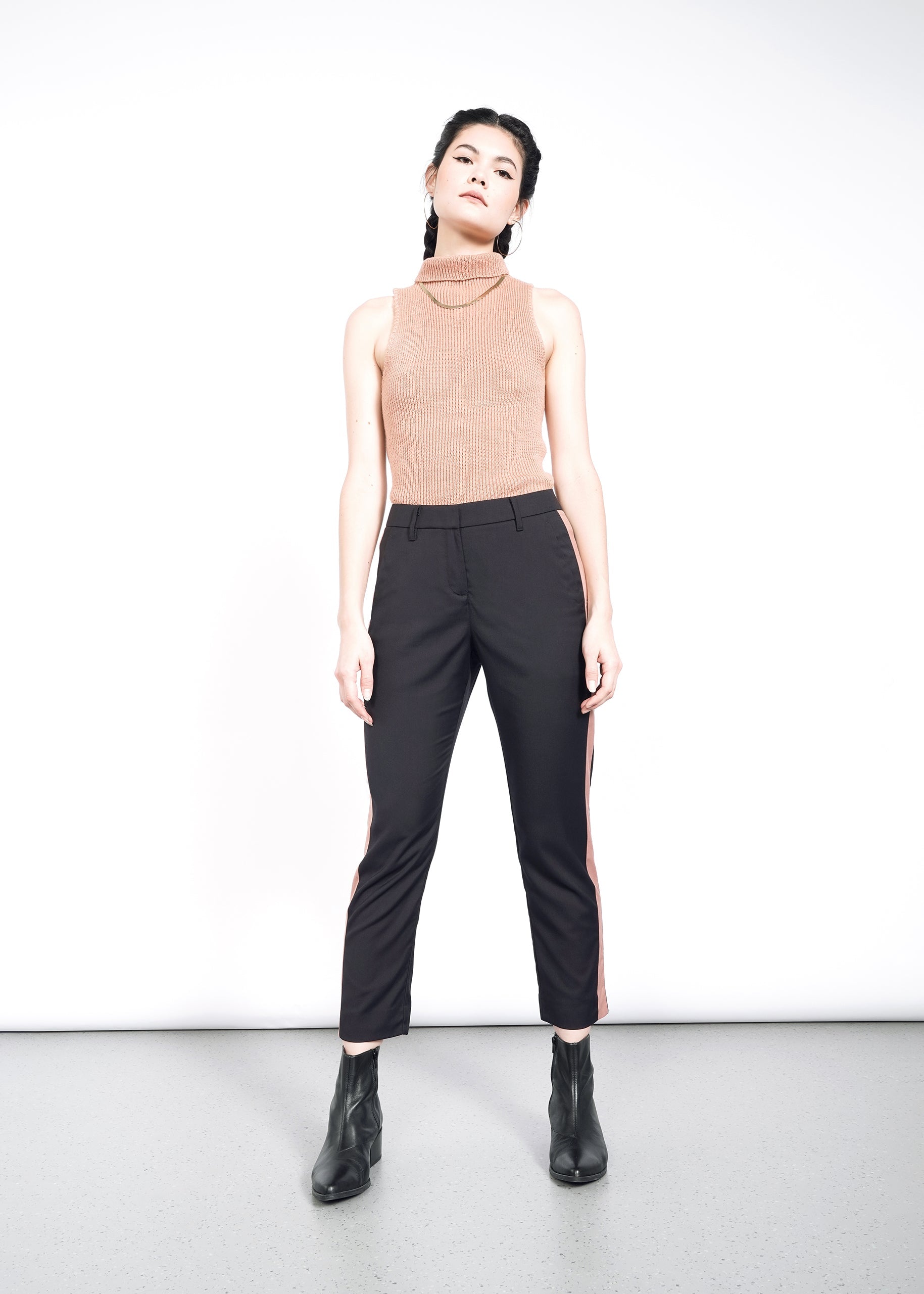 Model wearing The Empower Colorblock Slim Crop Pant in Black/Rose Brown