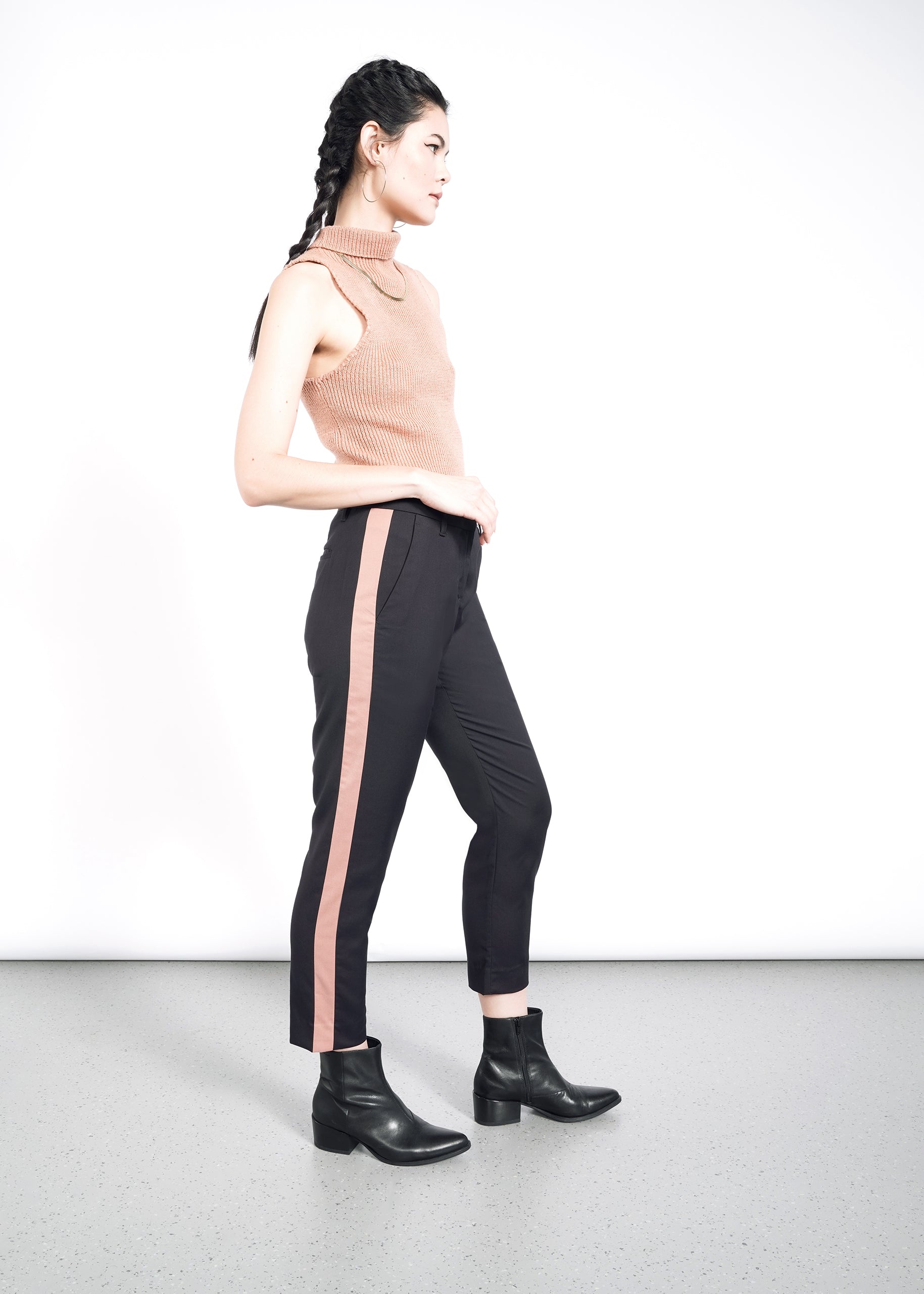 Model wearing The Empower Colorblock Slim Crop Pant in Black/Rose Brown