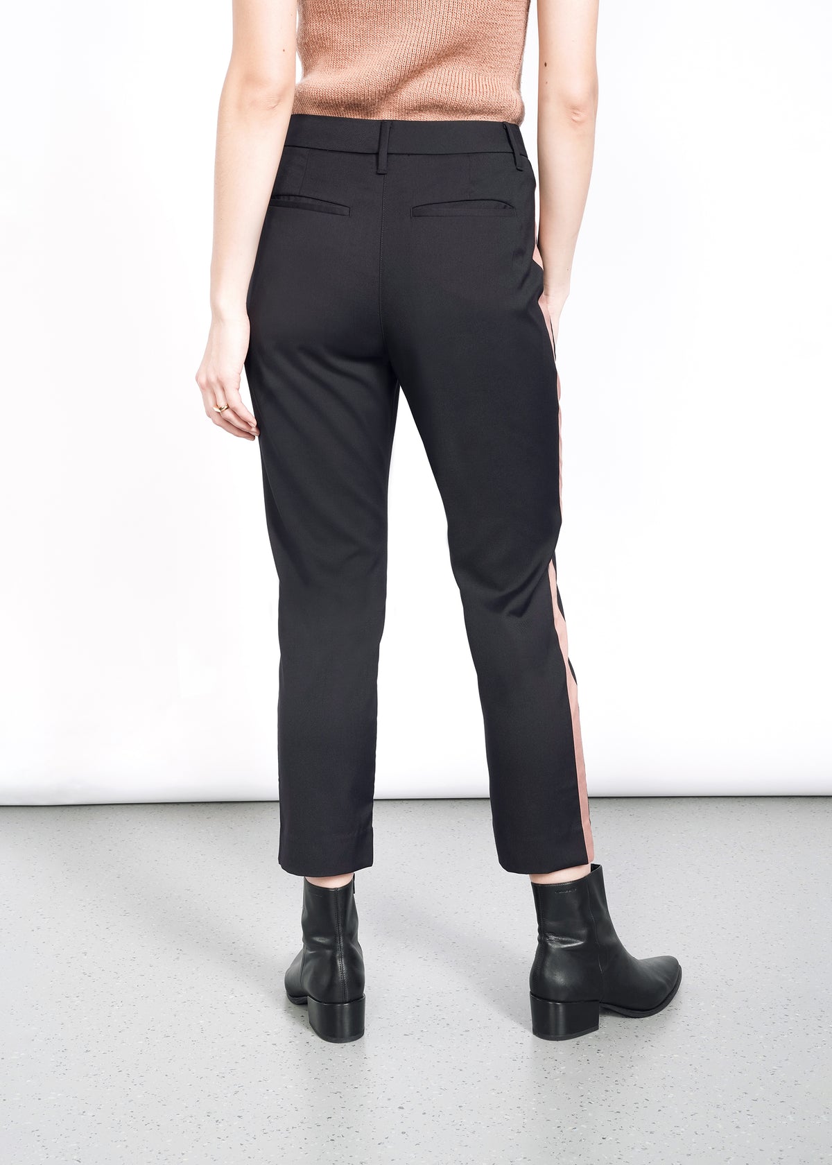Model wearing The Empower Colorblock Slim Crop Pant in Black/Rose Brown