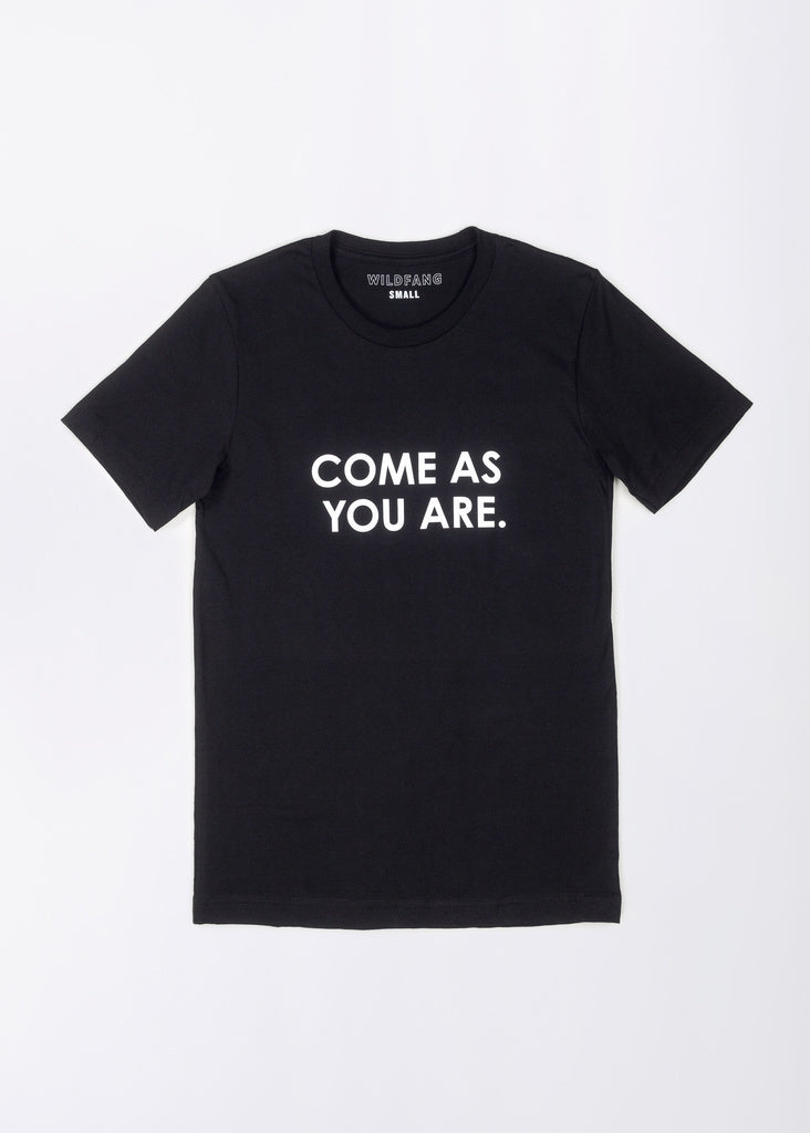 The Come As You Are Tee is a relaxed fit black t-shirt made from soft cotton, showcasing bold white COME AS YOU ARE text on the front. The slouchy tee is displayed flat against a plain white background.
